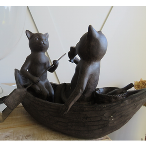 Cats Picnicking on a Boat